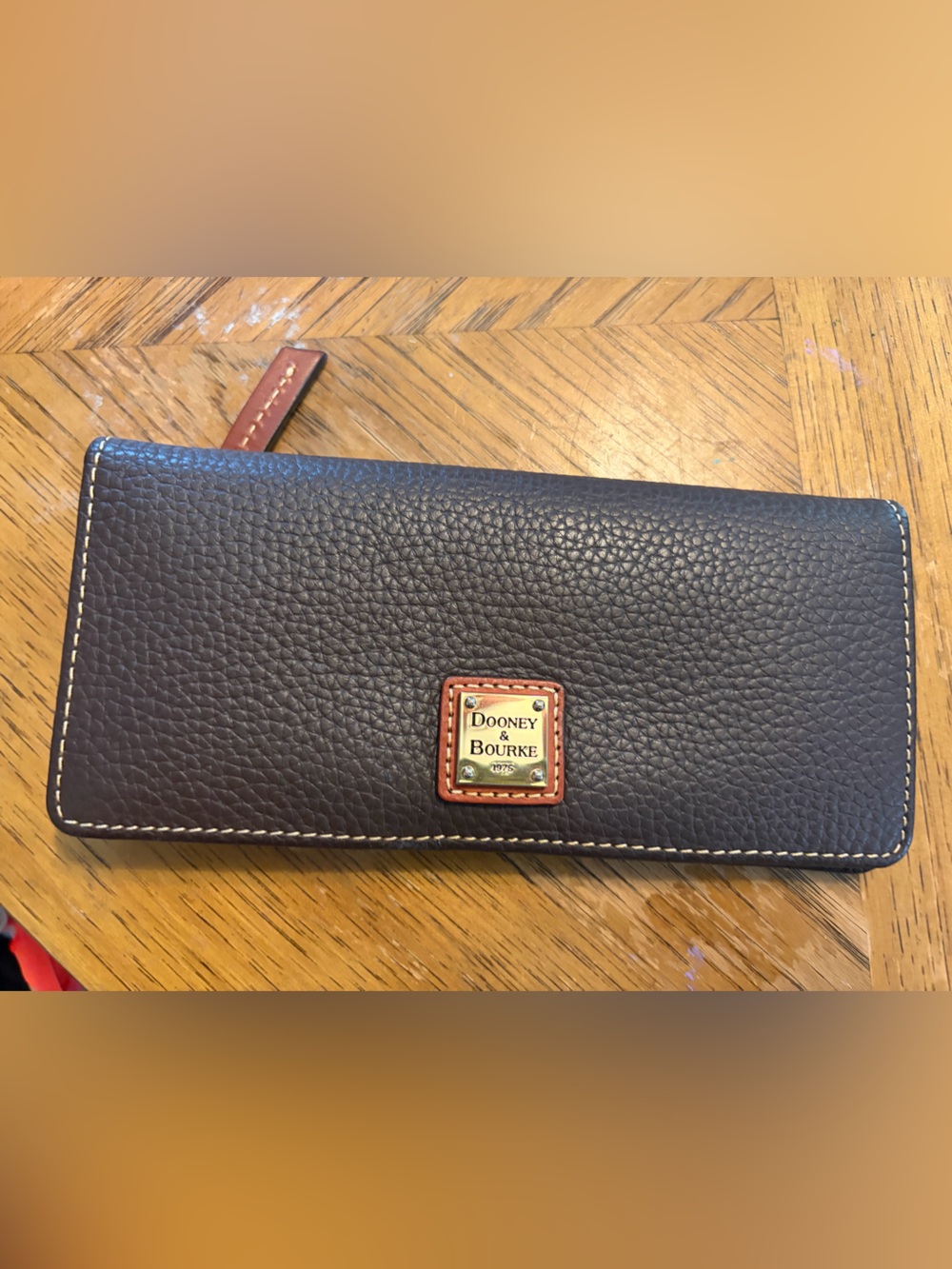 Dooney & Bourke Dark Brown Pebbled Leather Zip Wallet with Cognac Trim